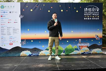 A person standing on a stage holding a microphone

AI-generated content may be incorrect.